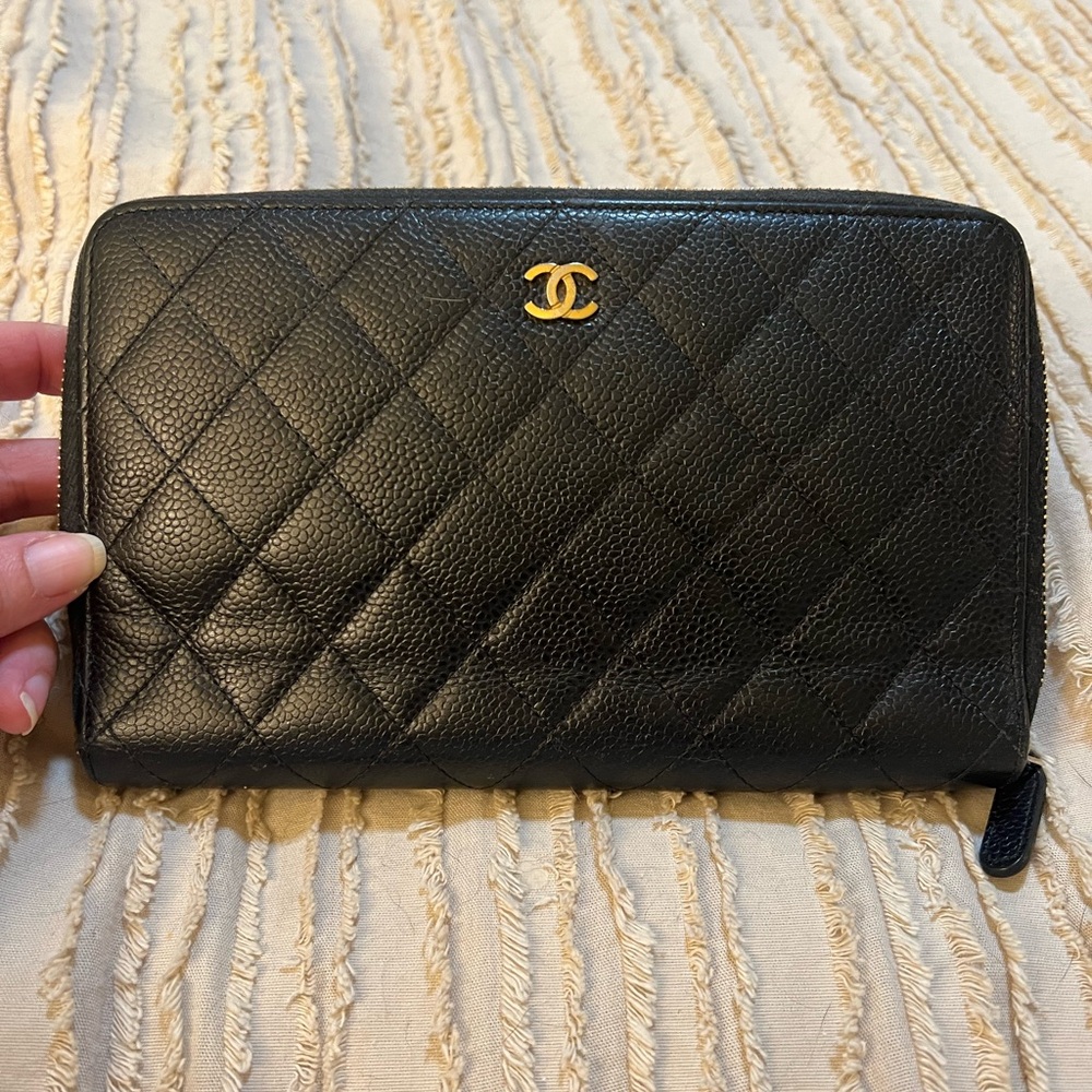 Authentic  large Chanel zip around wallet with cavier leather .